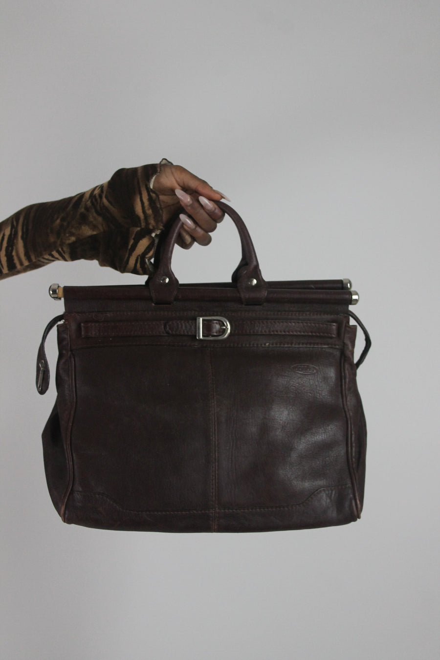 front view of dark brown structured handbag