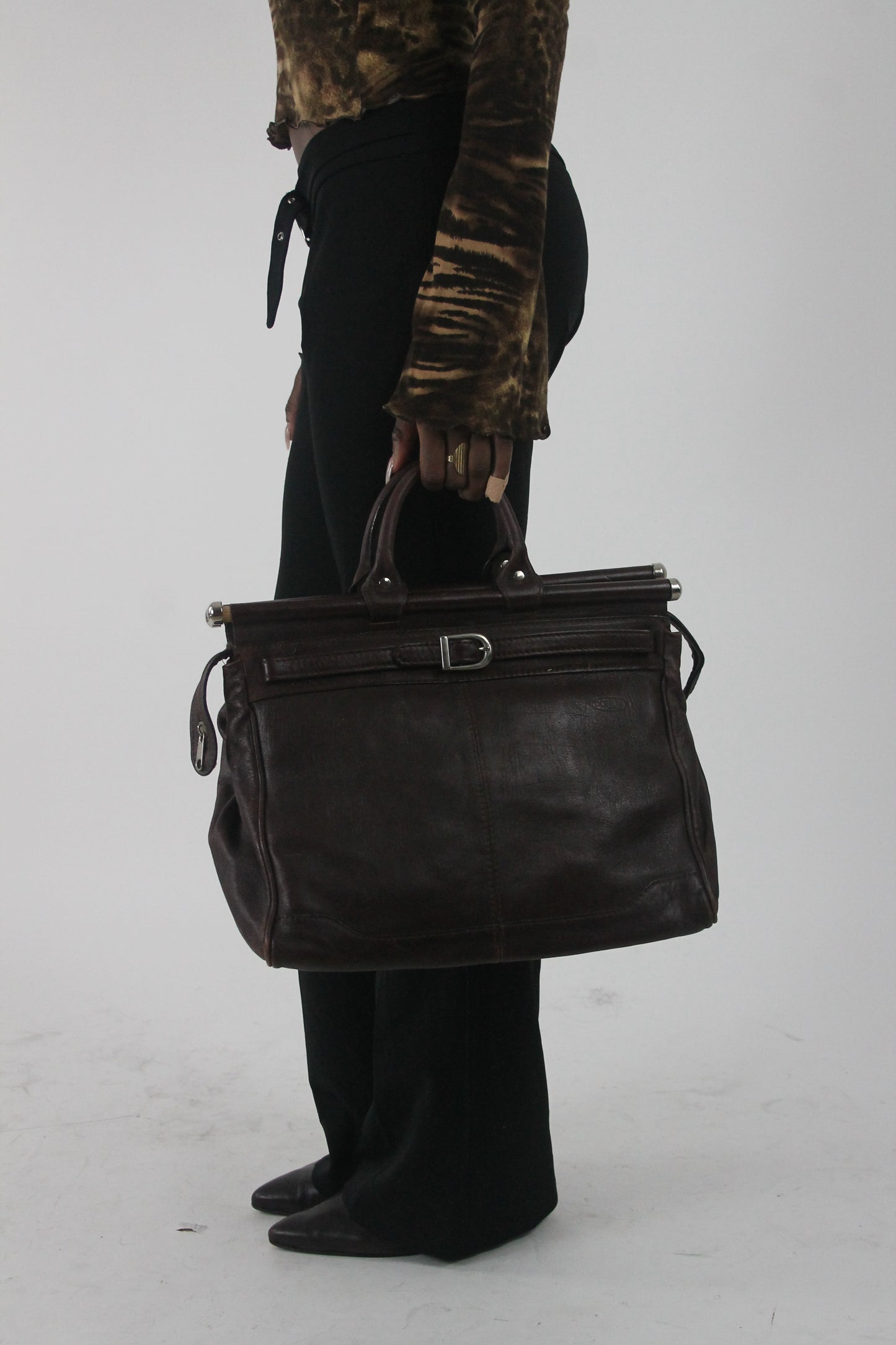 worn view of dark brown structured handbag