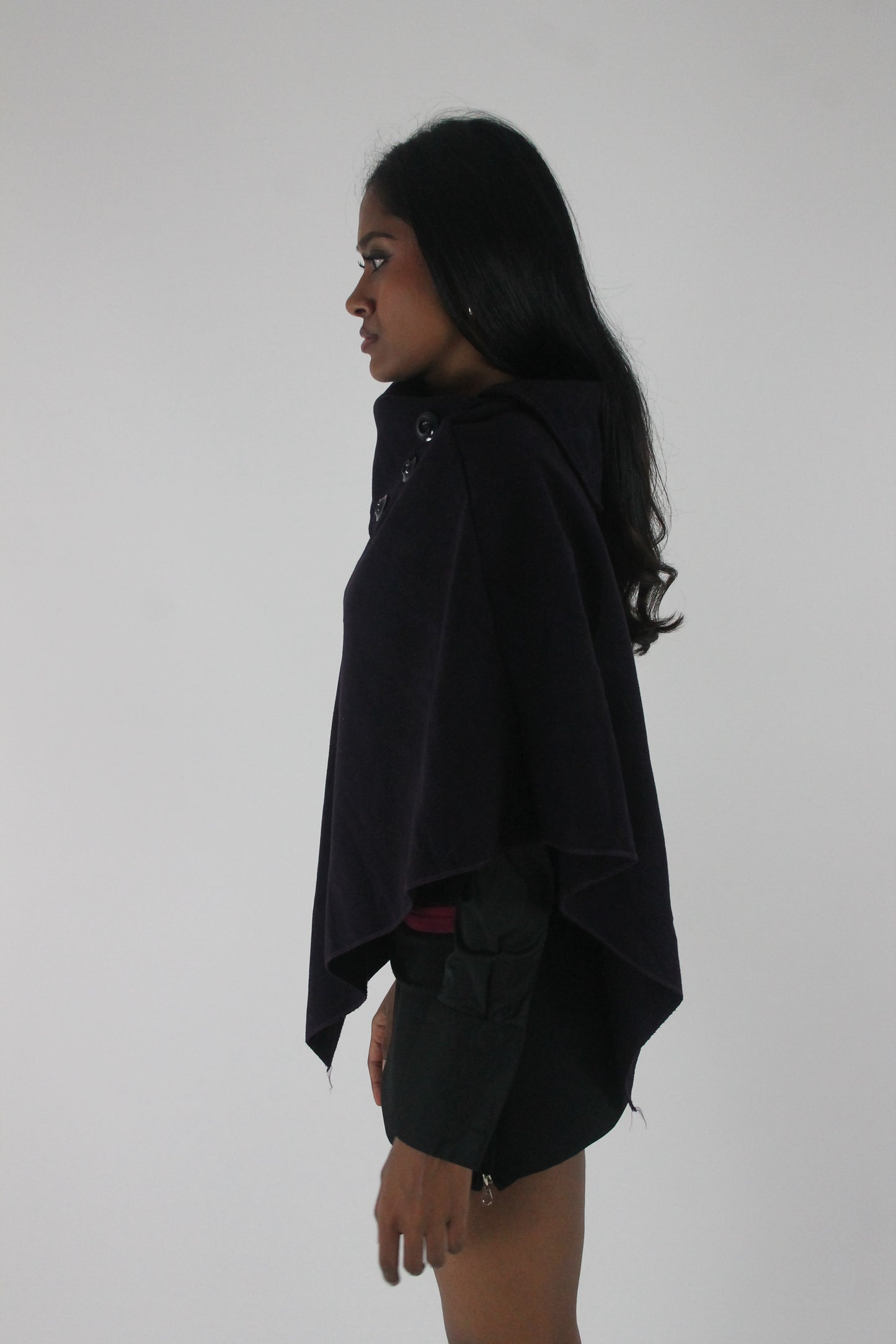 alternate-side view of dark purple button-detail asymmetric poncho
