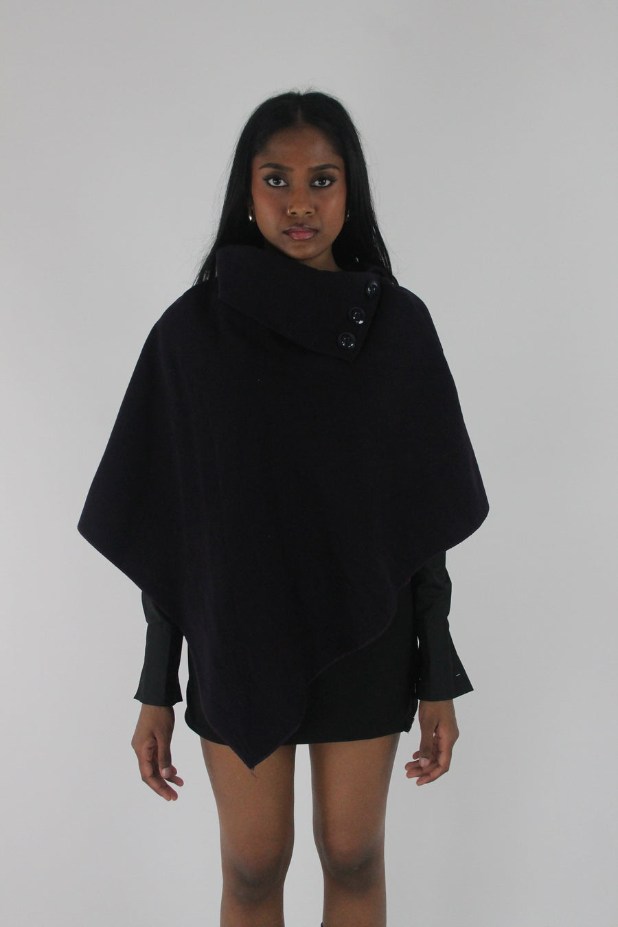 front view of dark purple button-detail asymmetric poncho