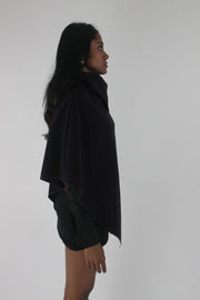 side view of dark purple button-detail asymmetric poncho
