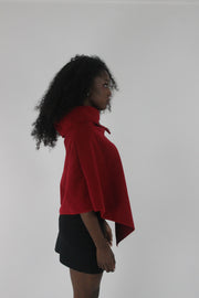 alternate-side view of red button-detail asymmetric poncho
