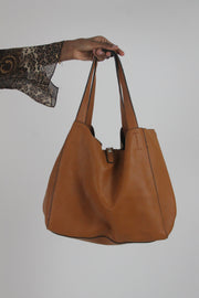 back view of tan studded large shoulder bag