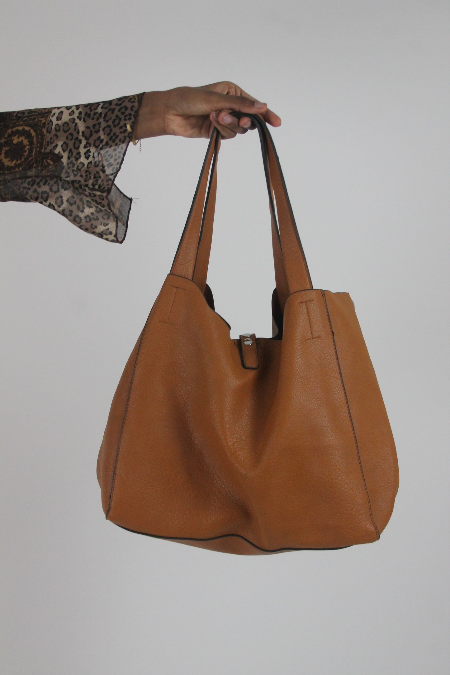 back view of tan studded large shoulder bag