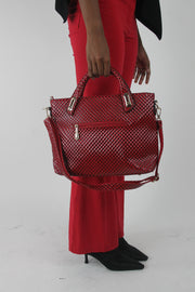 red woven-effect structured handbag carried by the top handles