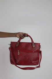 front view of red woven-effect structured handbag with shoulder strap