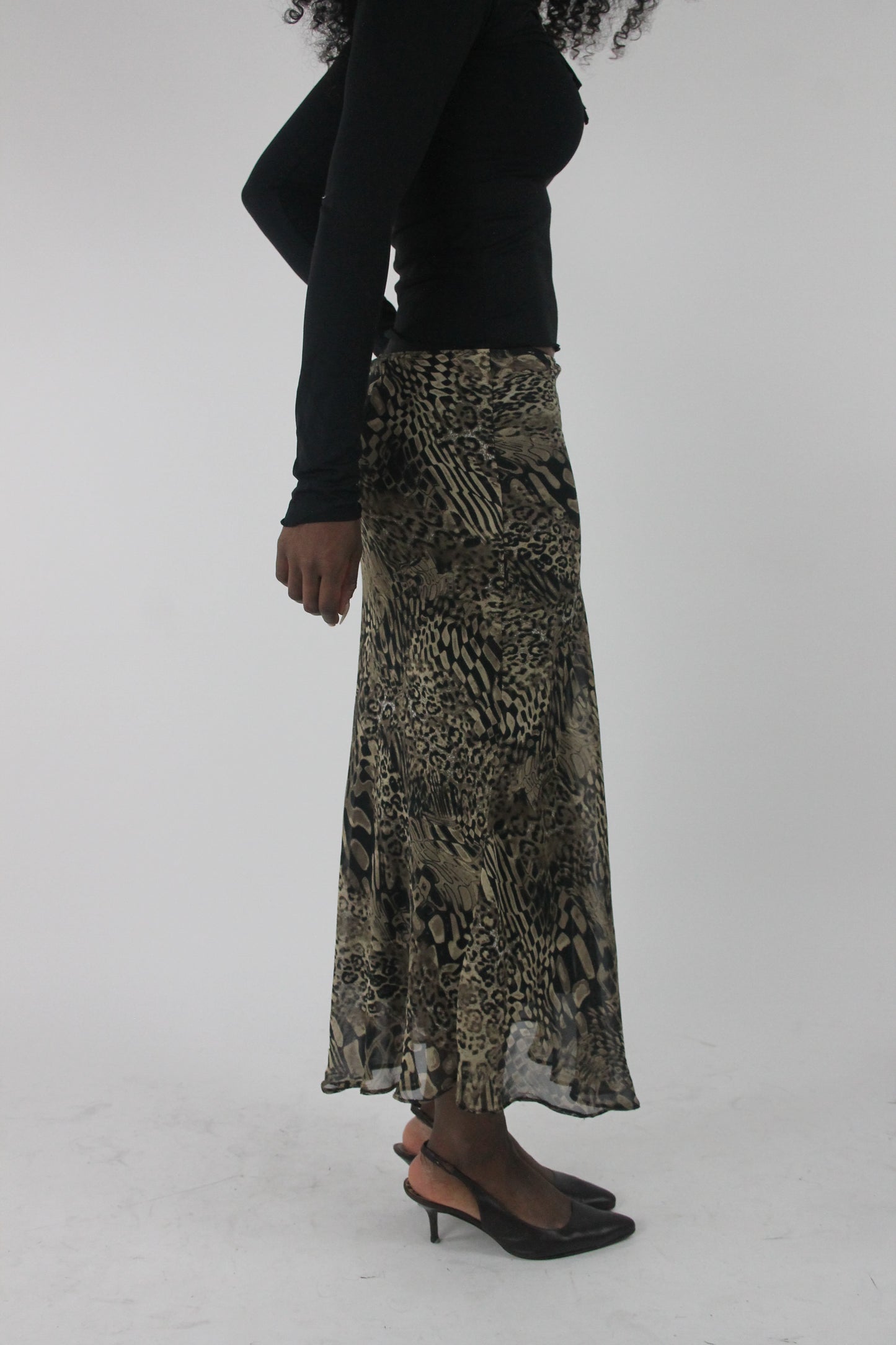 alternate-side view of beige and black animal-print mesh midi skirt