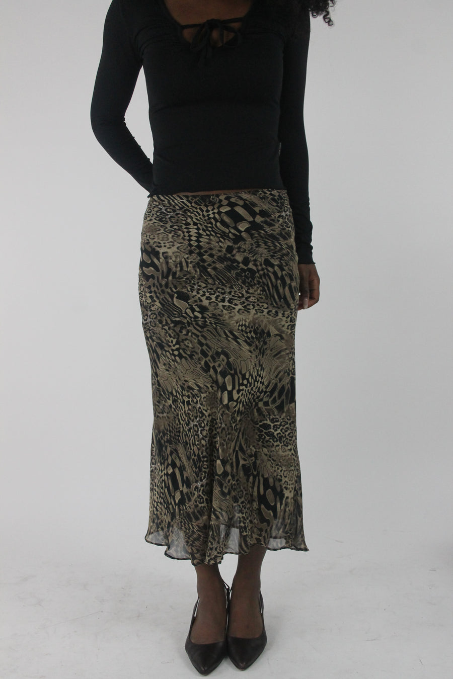 front view of beige and black animal-print mesh midi skirt
