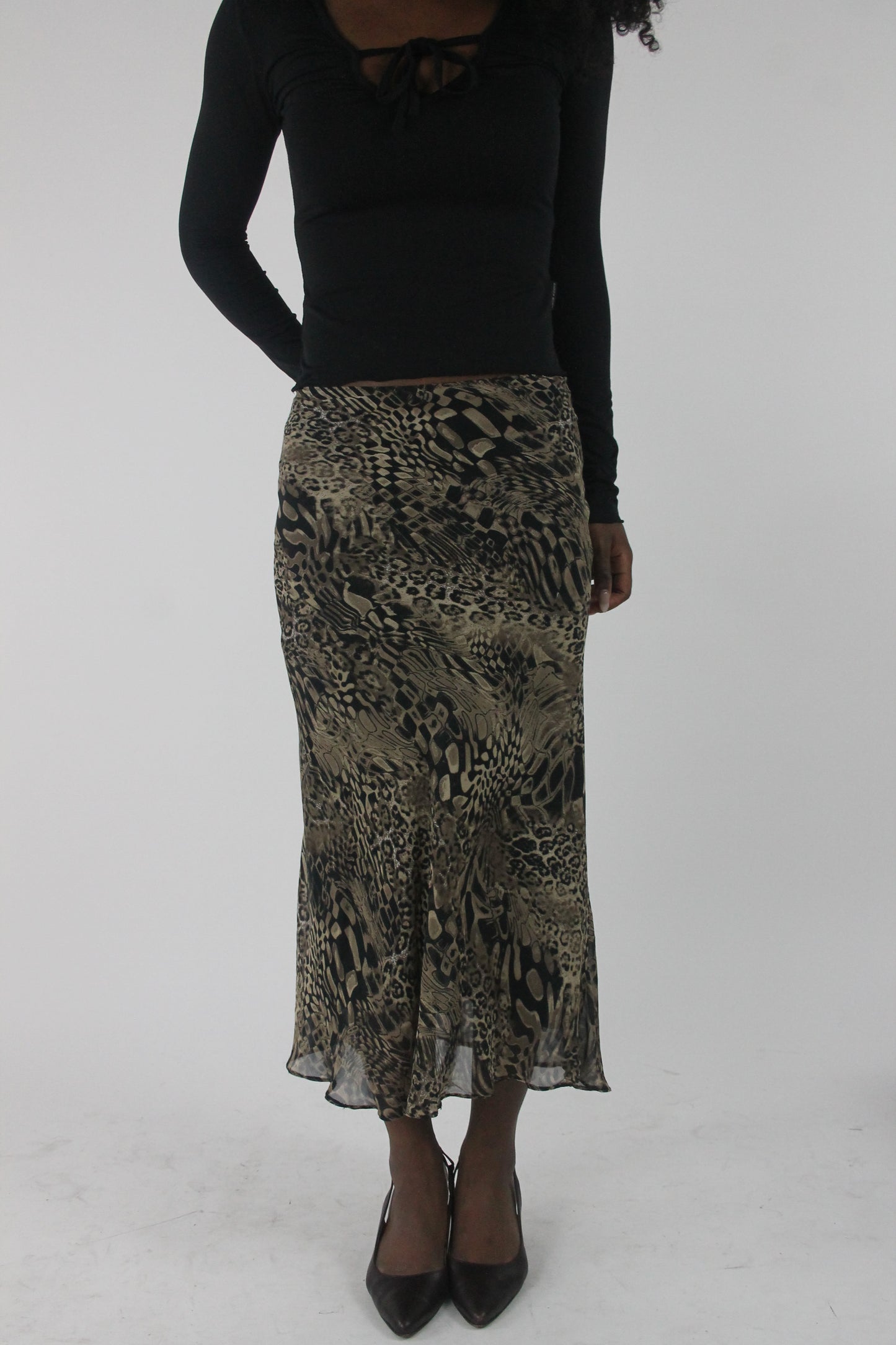 front view of beige and black animal-print mesh midi skirt