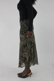 side view of beige and black animal-print mesh midi skirt