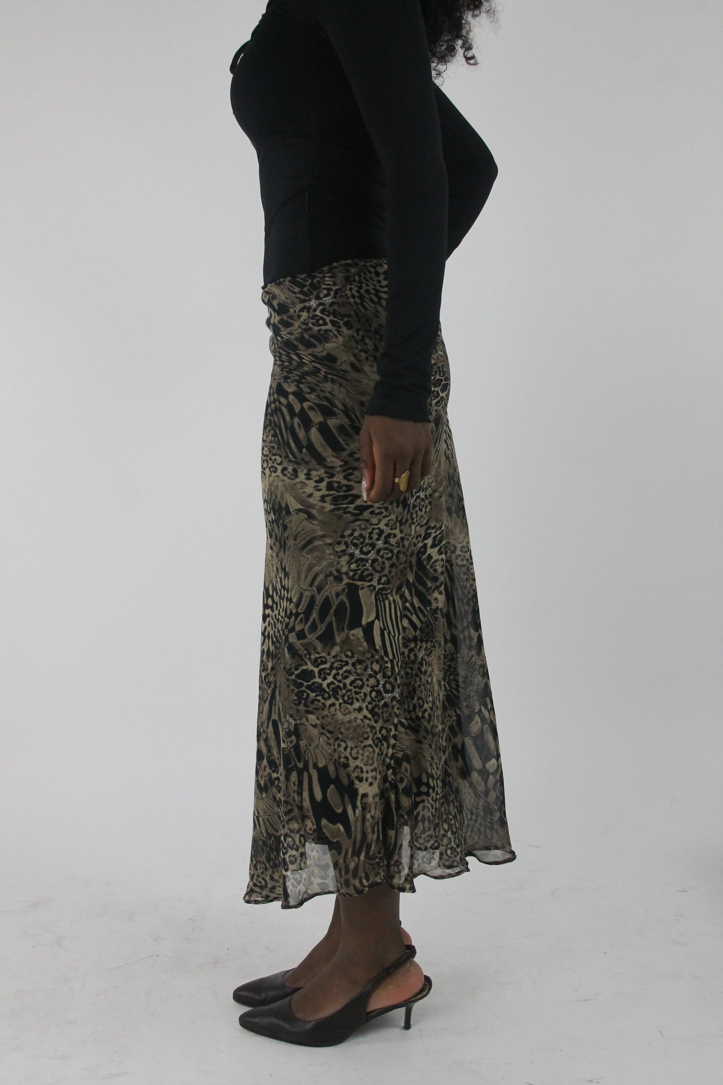 side view of beige and black animal-print mesh midi skirt