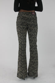 back view of black and cream zebra-print flared trousers