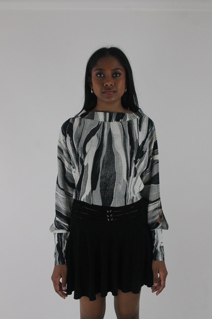 front view of black and grey abstract-striped asymmetric blouse