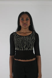 front view of black and grey zebra-pattern cropped top
