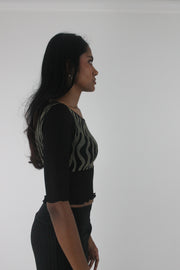 side view of black and grey zebra-pattern cropped top
