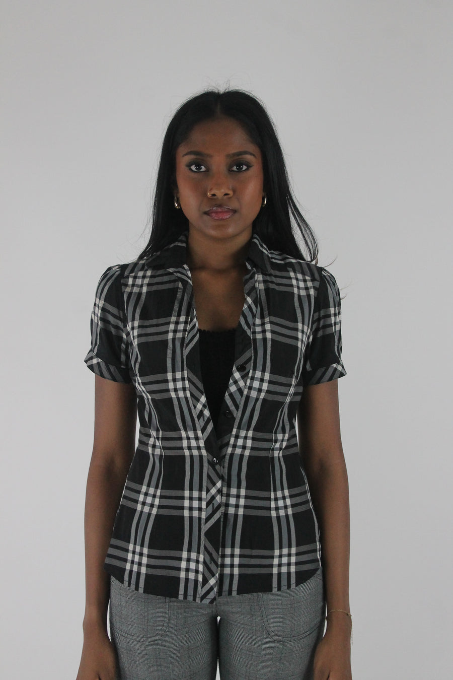 front view of black and white plaid short-sleeve fitted blazer