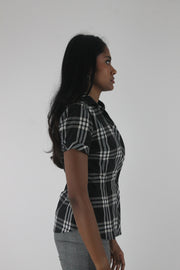 side view of black and white plaid short-sleeve fitted blazer