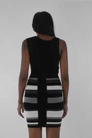 back view of black and white striped cowl-neck sleeveless mini dress