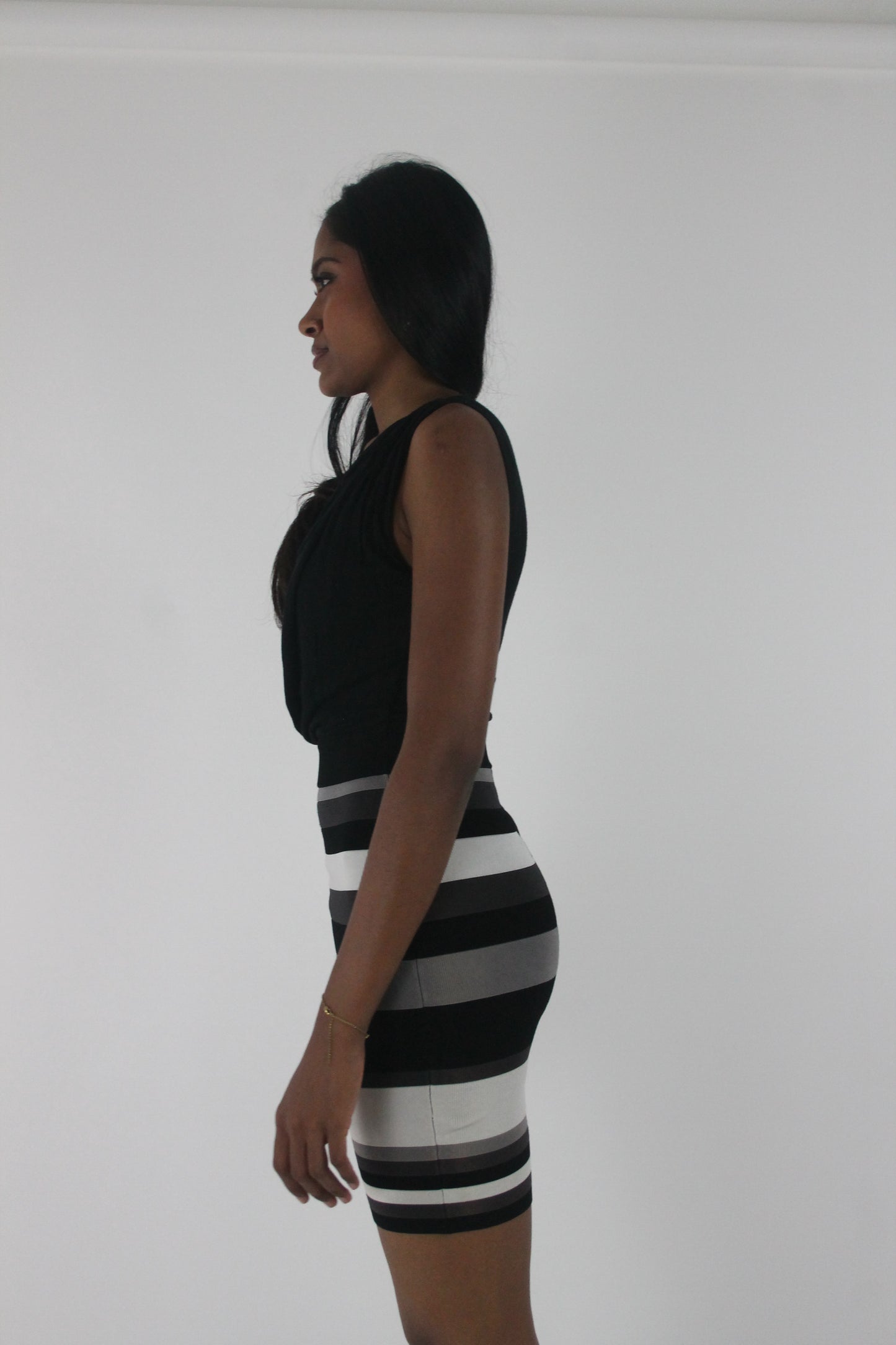 detail view of black and white striped cowl-neck sleeveless mini dress
