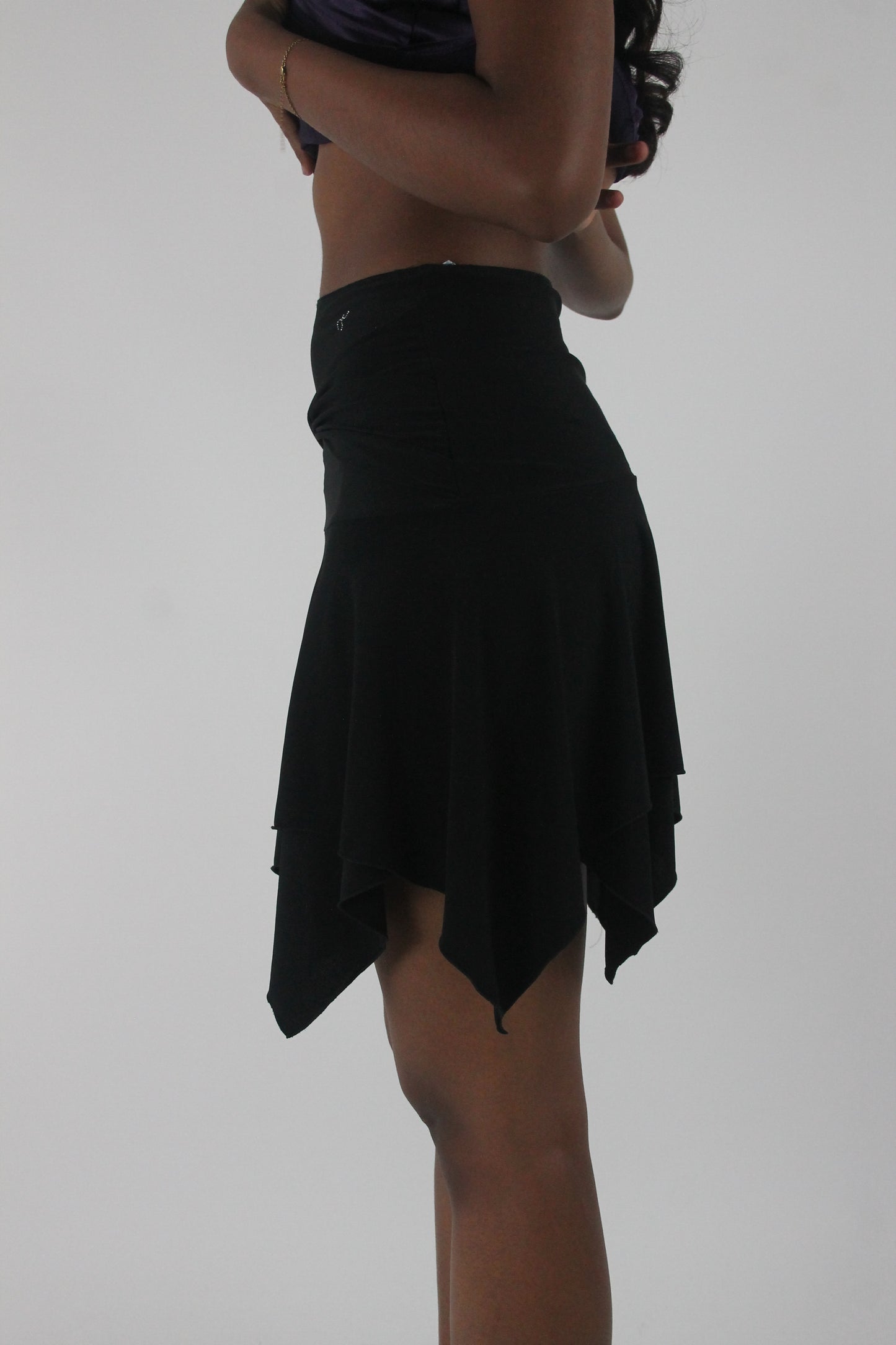 alternate-side view of black asymmetric handkerchief-hem skirt