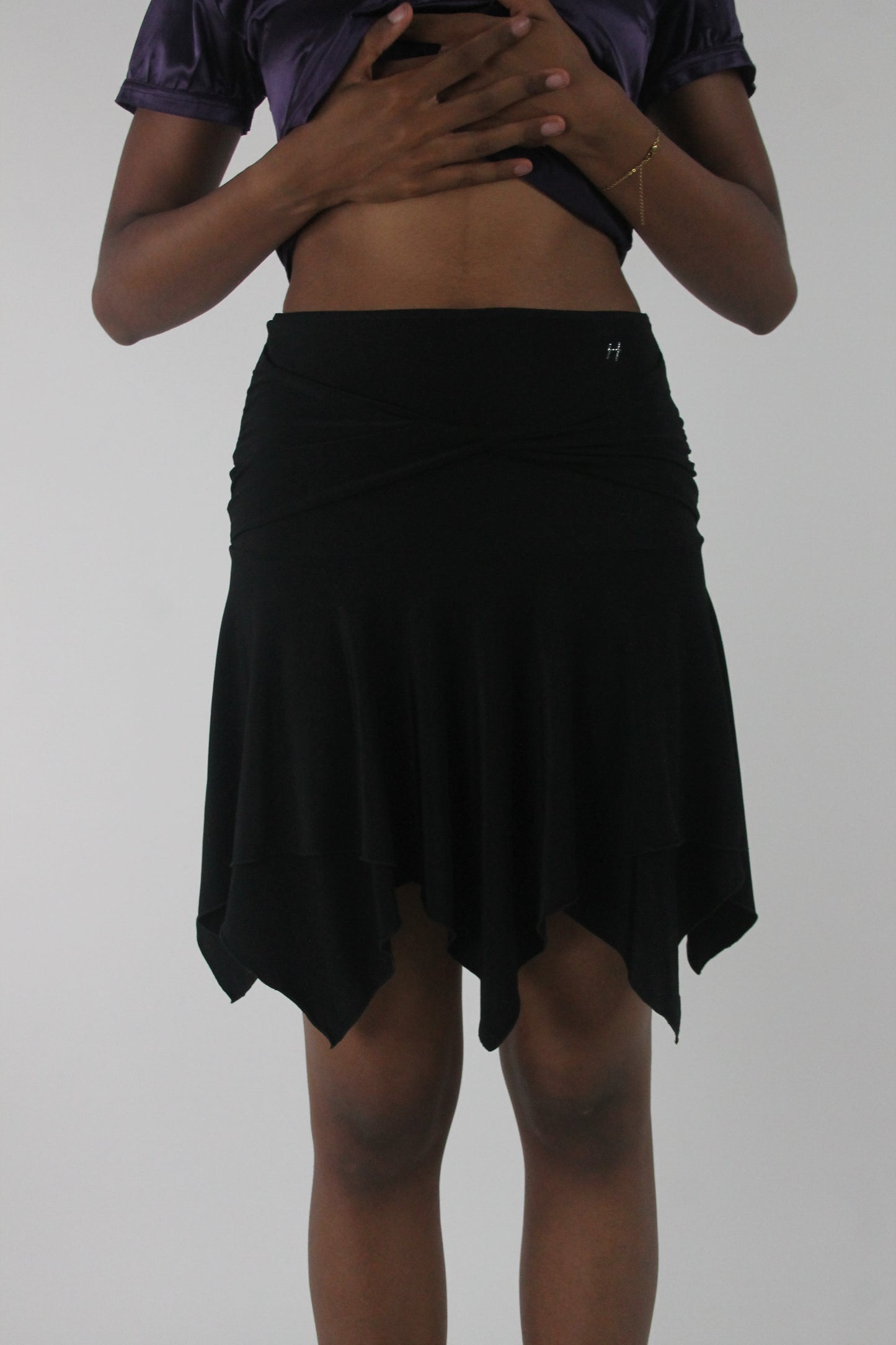 front view of black asymmetric handkerchief-hem skirt