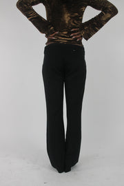 back view of black buckle-belt flared trousers