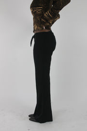 side view of black buckle-belt flared trousers