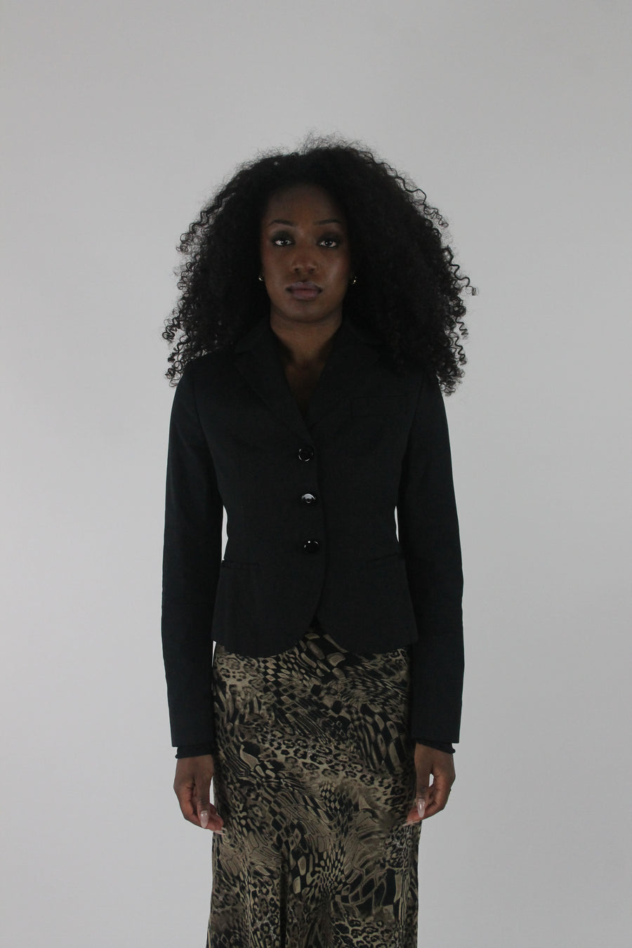 front view of black cropped single-button blazer