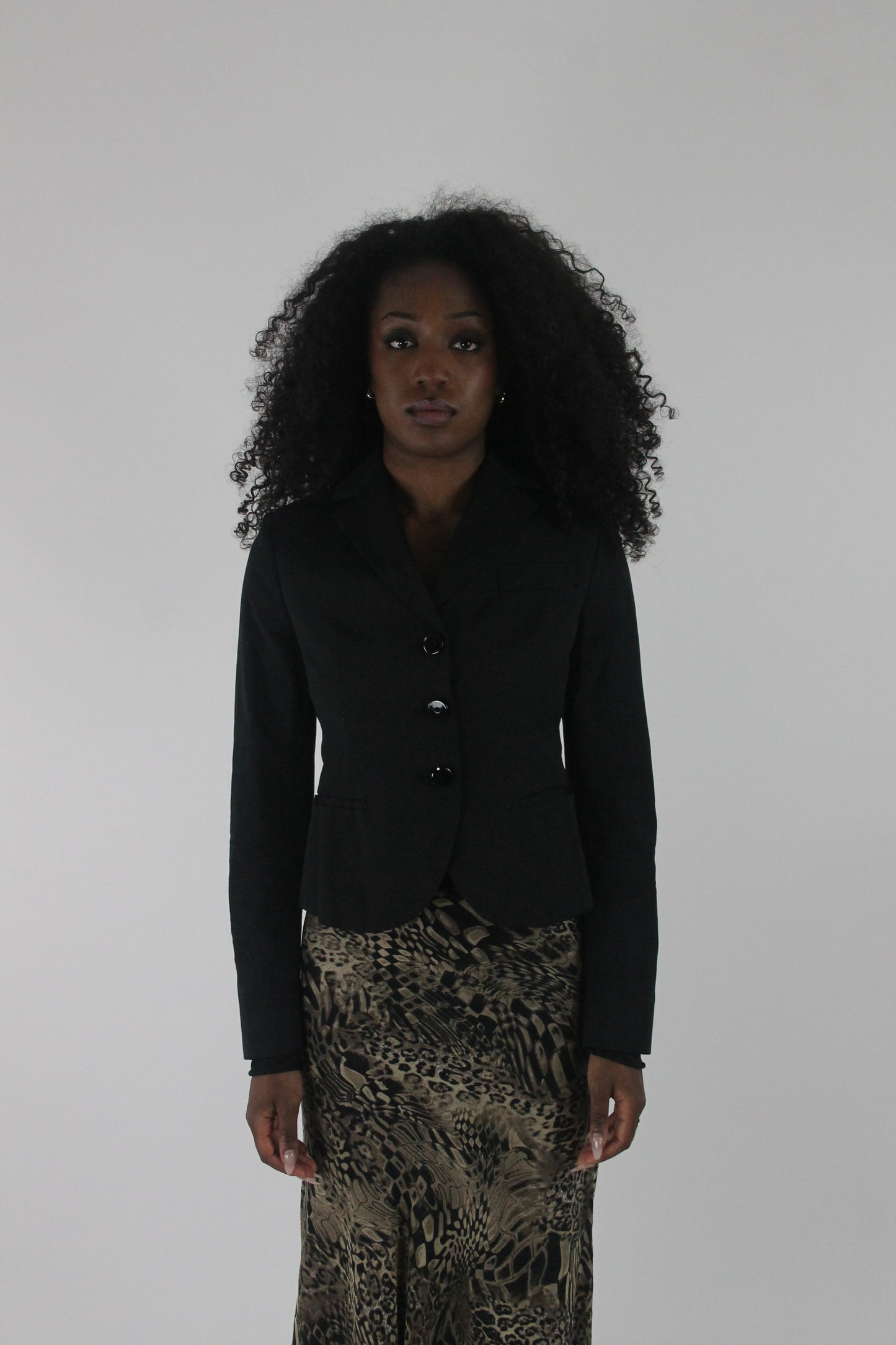 front view of black cropped single-button blazer