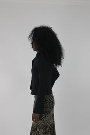 side view of black cropped single-button blazer