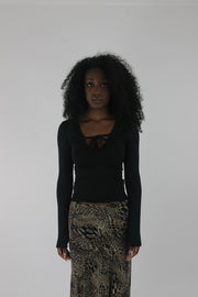 front view of black cutout-neckline long-sleeve top