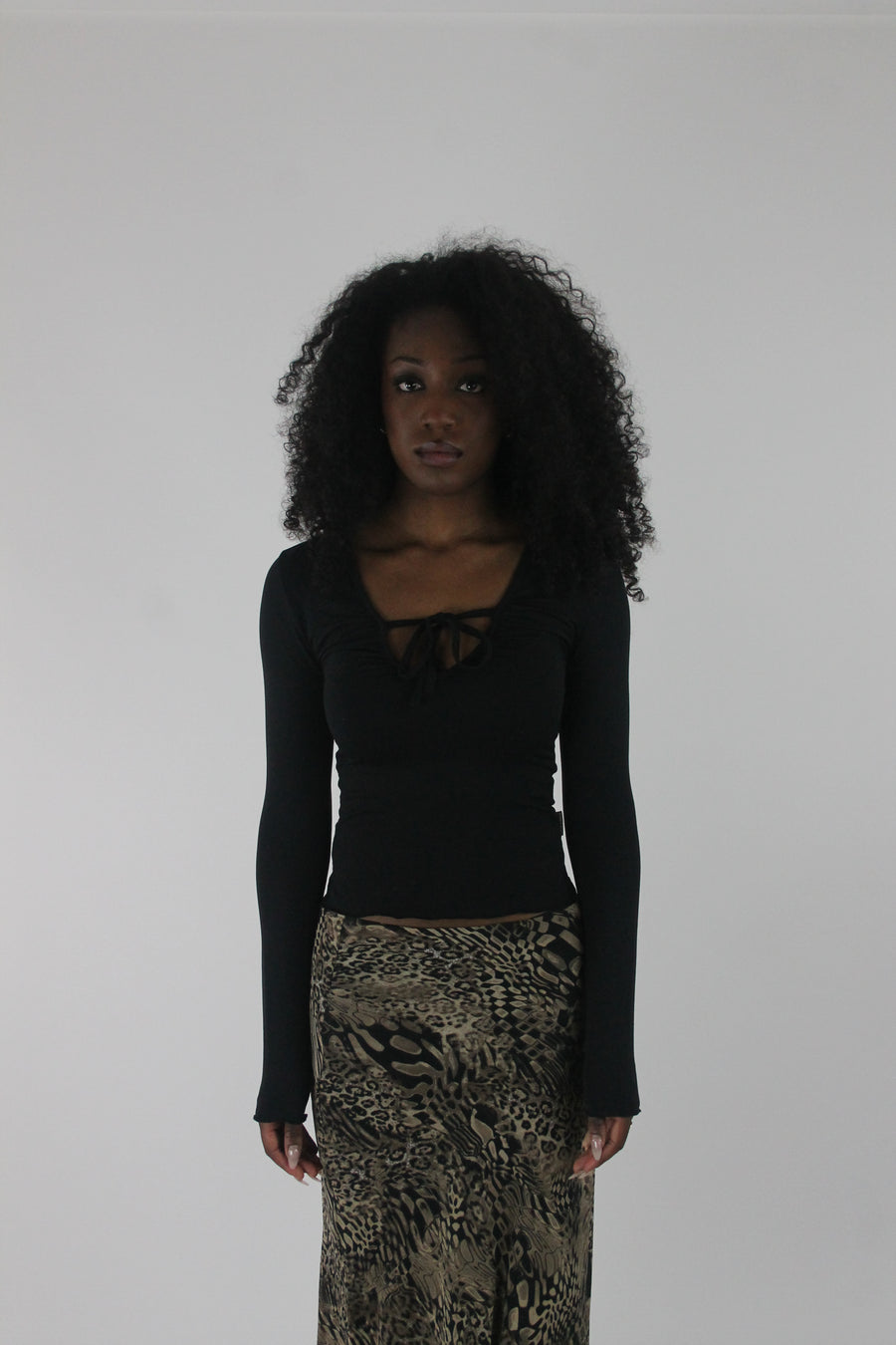 front view of black cutout-neckline long-sleeve top