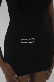 detail view of black high-neck sleeveless buckle-detail mini dress