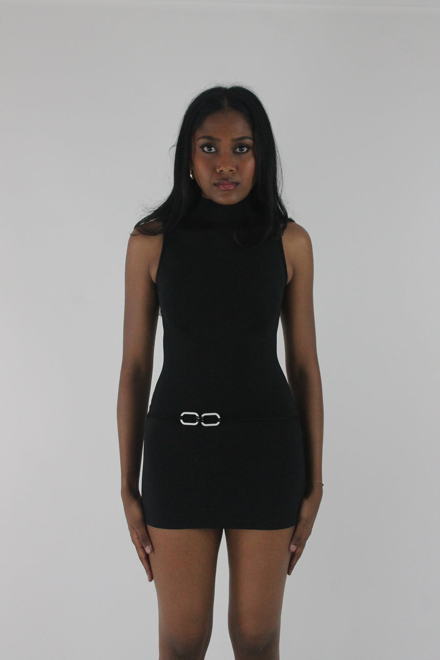 front view of black high-neck sleeveless buckle-detail mini dress