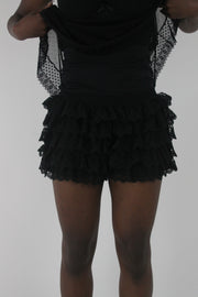 front view of black layered ruffle mini skirt