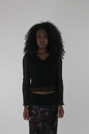 front view of black mesh ruffle-hem long-sleeve top