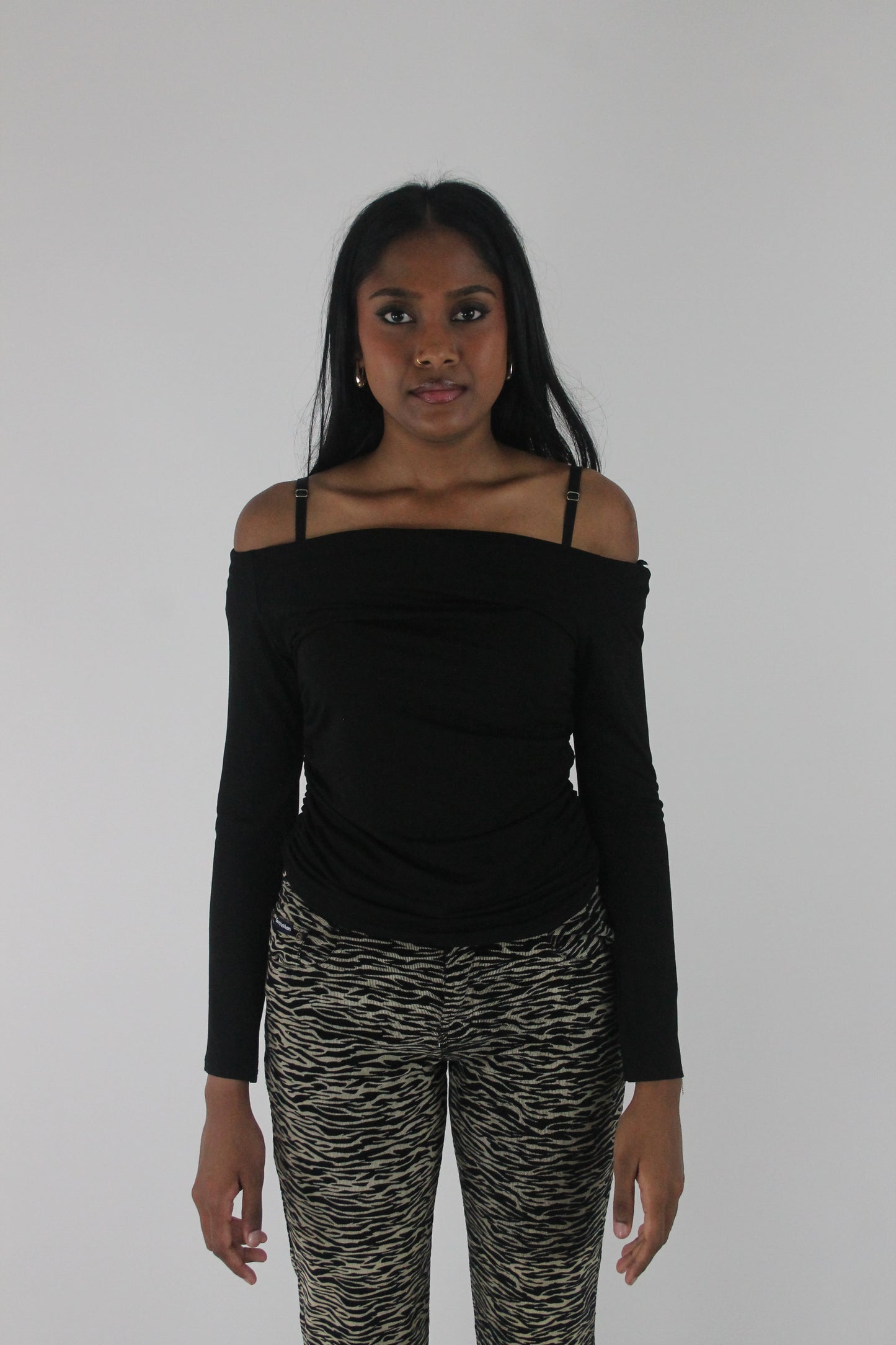 front view of black off-shoulder long-sleeve top
