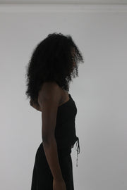alternate-side view of black pinstripe lace-up corset top