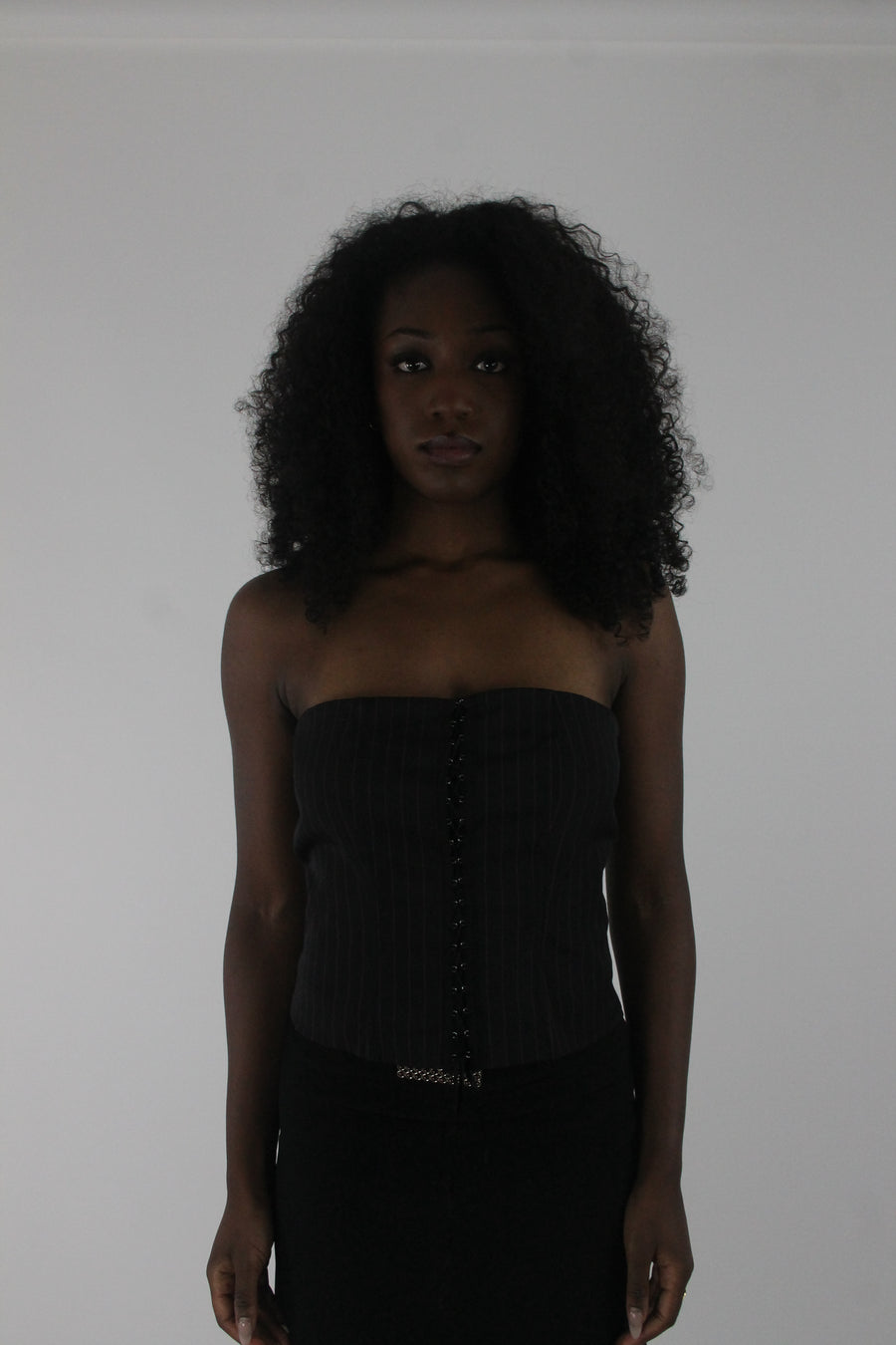 front view of black pinstripe lace-up corset top