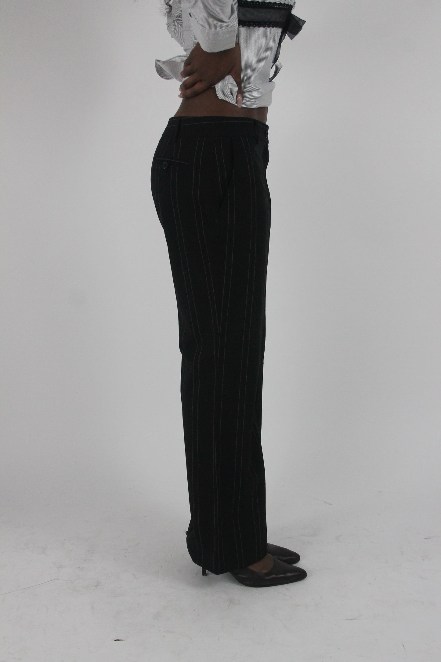 alternate-side view of black pinstripe wide-leg trousers