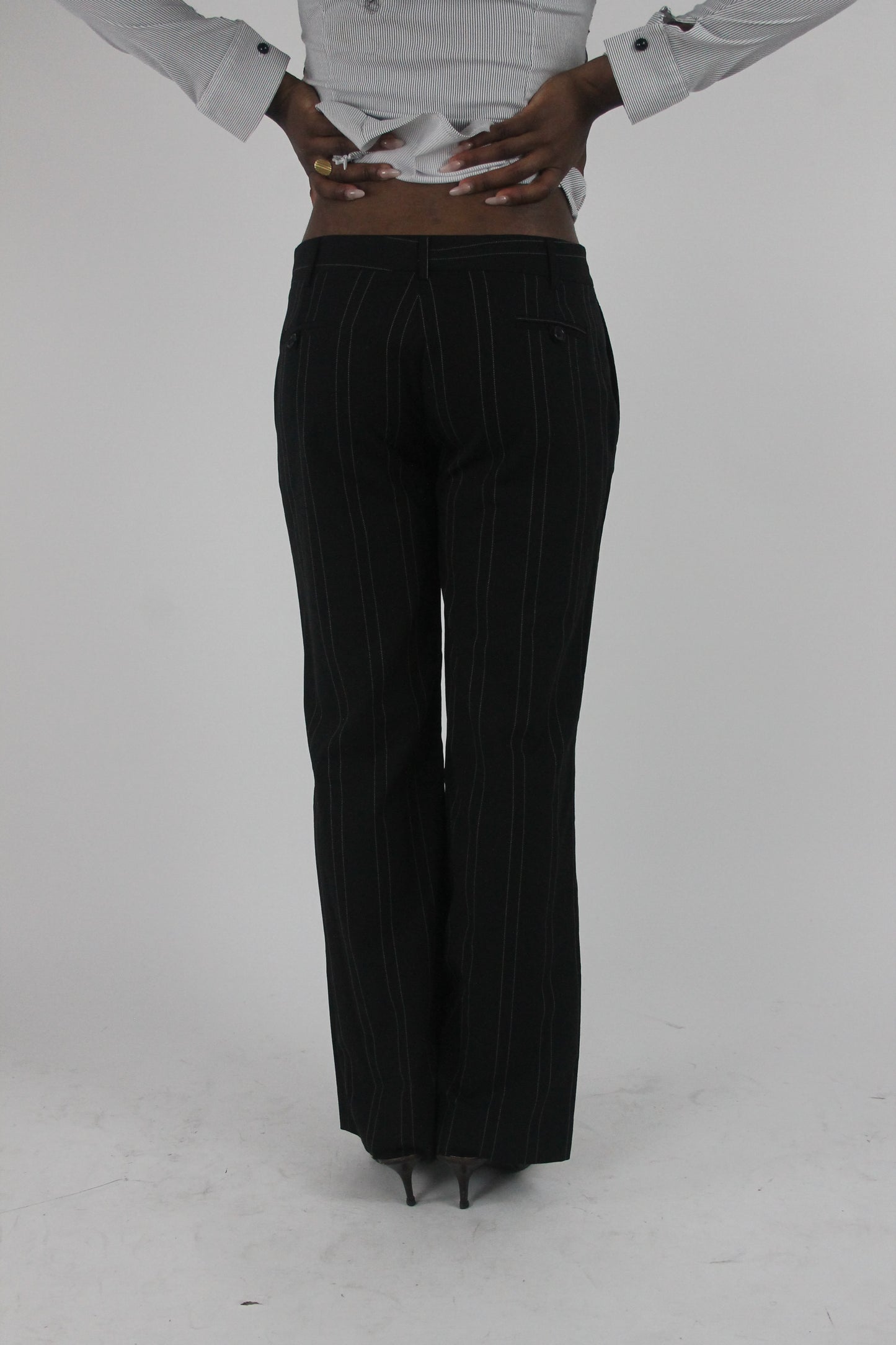 back view of black pinstripe wide-leg trousers