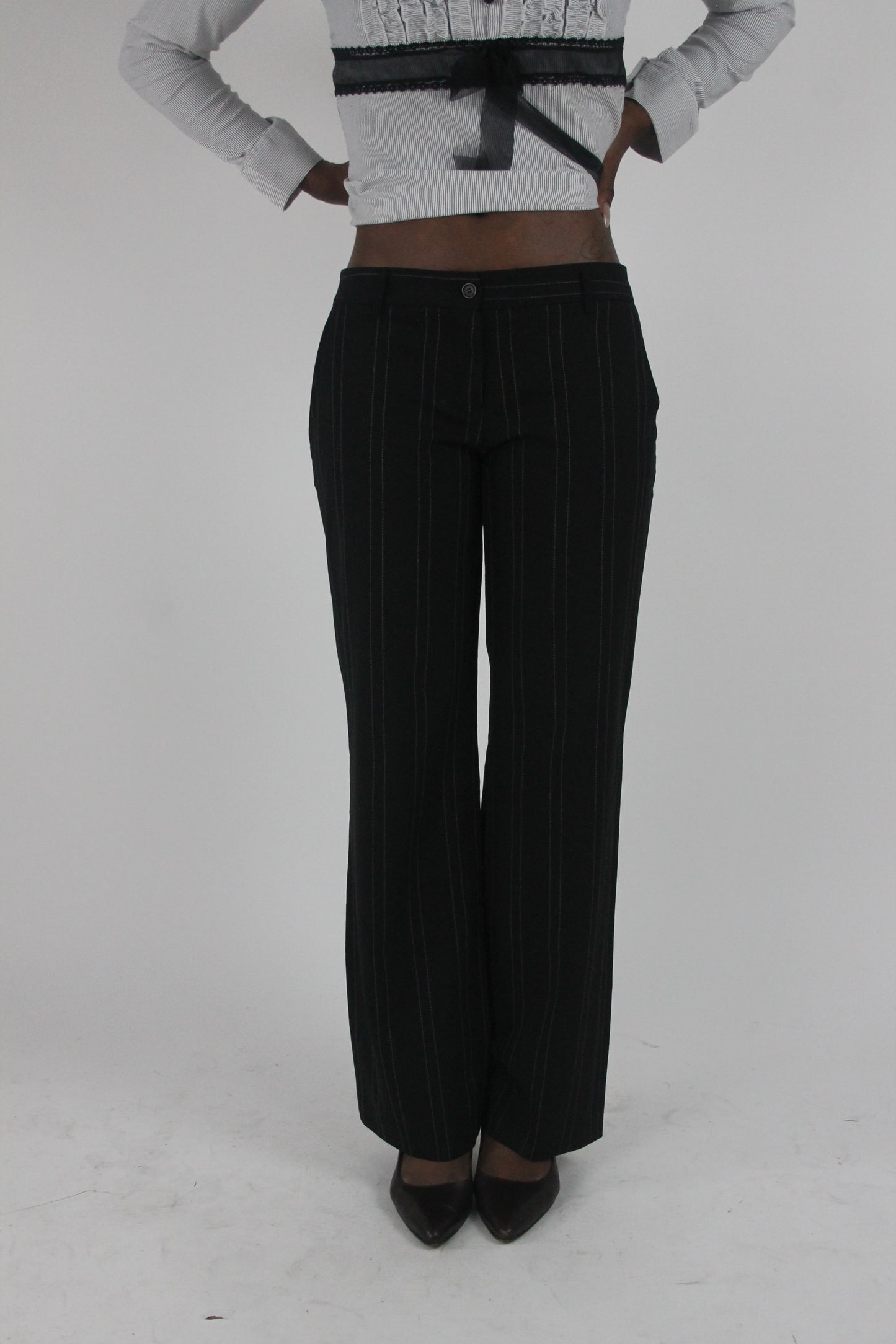 front view of black pinstripe wide-leg trousers