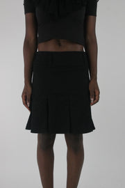 front view of black pleated mini skirt