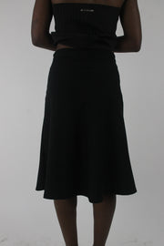 back view of black rhinestone-buckle midi skirt