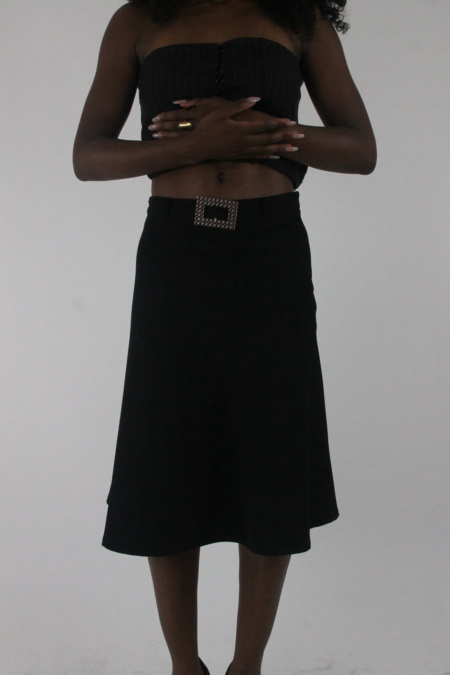 front view of black rhinestone-buckle midi skirt