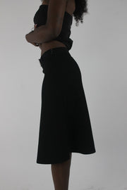 side view of black rhinestone-buckle midi skirt