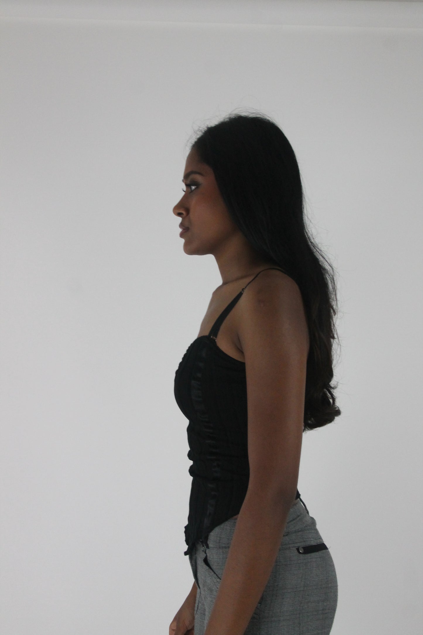 alternate-side view of black ruched-front spaghetti-strap top