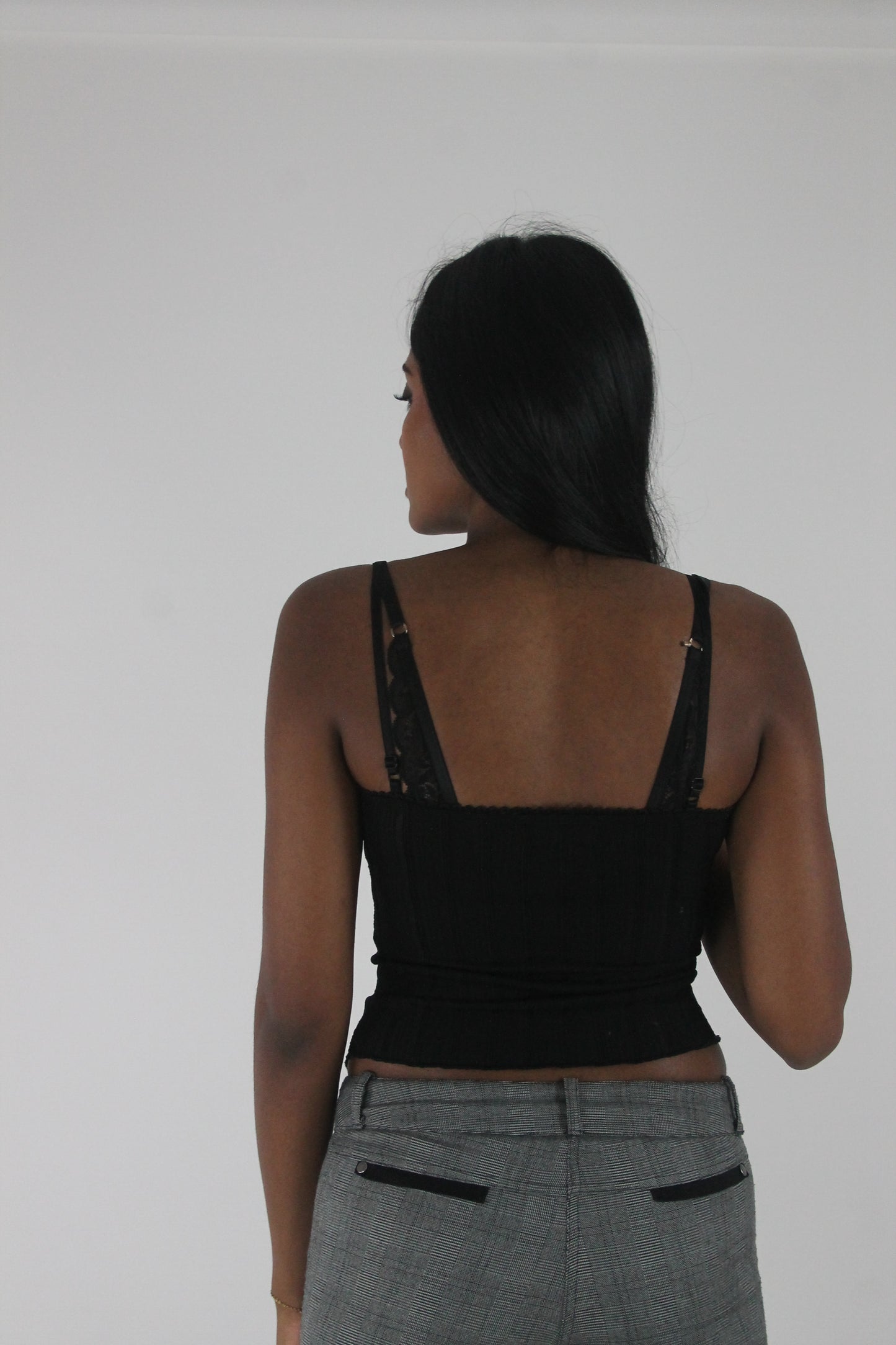 back view of black ruched-front spaghetti-strap top