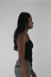 side view of black ruched-front spaghetti-strap top