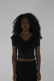 front view of black ruffle cropped short-sleeve top